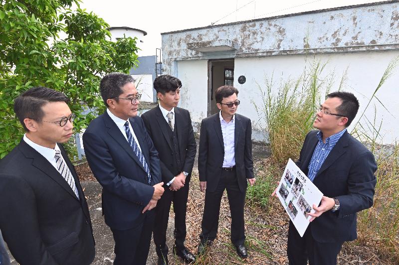 The Secretary for Development, Mr Michael Wong, visited the former Lau Fau Shan Police Station revitalisation project during his visit to Yuen Long District today (October 25). Photo shows Mr Wong (second left) being briefed by the Commissioner for Heritage, Mr Jose Yam (first right), on the plan for the restoration and revitalisation of the former Lau Fau Shan Police Station. Looking on are the Chairman of the Yuen Long District Council, Mr Shum Ho-kit (centre); the District Officer (Yuen Long), Mr Enoch Yuen (first left); and the Under Secretary for Development, Mr Liu Chun-san (second right).