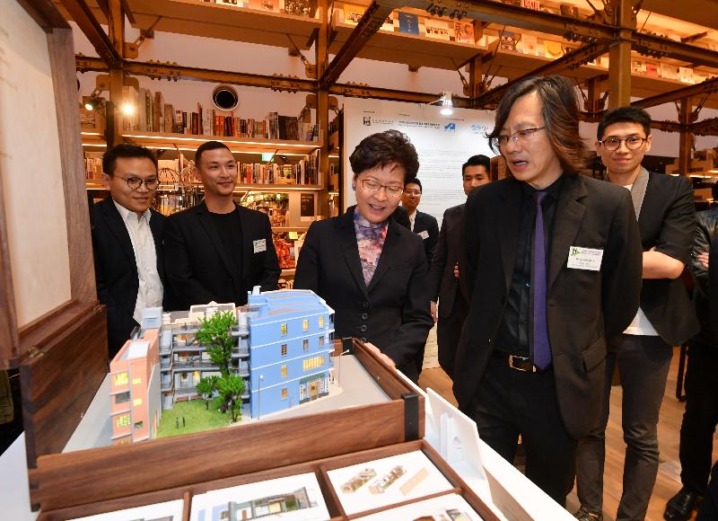 The Chief Executive, Mrs Carrie Lam, continued her visit to Japan in Tokyo today (October 31) and attended the Hong Kong Institute of Architects Tokyo Exhibition "More than High-rise: Exploring Hong Kong through Architecture". Photo shows Mrs Lam (third left), accompanied by  Project Leader of the Exhibition and Immediate Past President of HKIA, Mr Vincent Ng (second right) touring the exhibition.