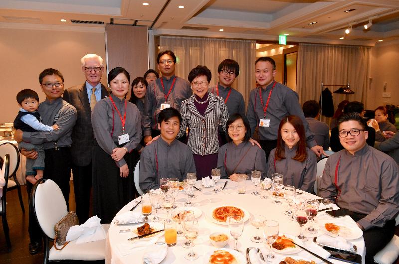 The Chief Executive, Mrs Carrie Lam, continued her visit to Japan in Tokyo today (October 31) and attended "Asian Youth Orchestra (AYO) Alumni Special Concert – Celebrating Friendship between Japan and Hong Kong" presented by more than 20 alumni of the AYO from Hong Kong and Japan in the evening. Photo shows Mrs Lam (centre) and the musicians at the post-concert dinner.