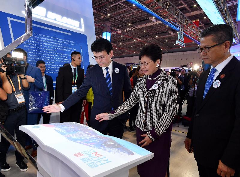 The Chief Executive, Mrs Carrie Lam, toured the China International Import Expo in Shanghai this afternoon (November 5). Photo shows Mrs Lam (second right); the Financial Secretary, Mr Paul Chan (first right); and the Secretary for Commerce and Economic Development, Mr Edward Yau (third right), using the Magic Book at the Hong Kong Exhibition Area.