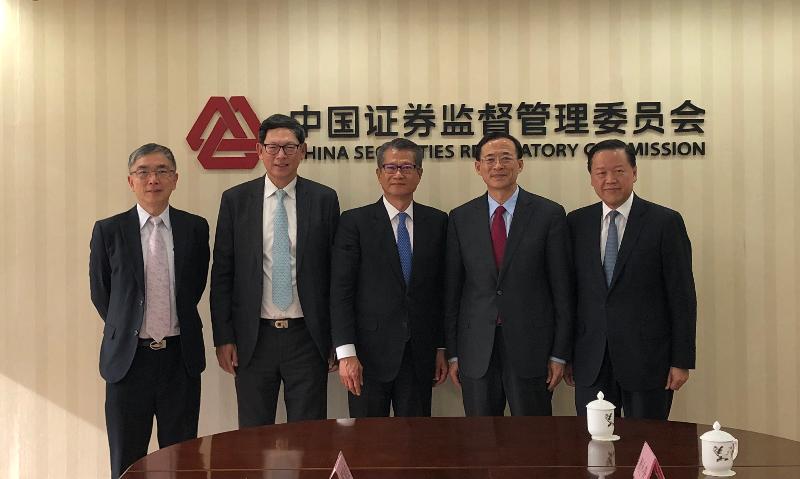 The Financial Secretary, Mr Paul Chan, today (November 20) visited Beijing. Photo shows Mr Chan (centre) meeting with the Chairman of the China Securities Regulatory Commission, Mr Liu Shiyu (second right). Also present are the Secretary for Financial Services and the Treasury, Mr James Lau (first left); the Chief Executive of the Hong Kong Monetary Authority, Mr Norman Chan (second left); and the Chairman of the Securities and Futures Commission, Mr Tim Lui (first right).