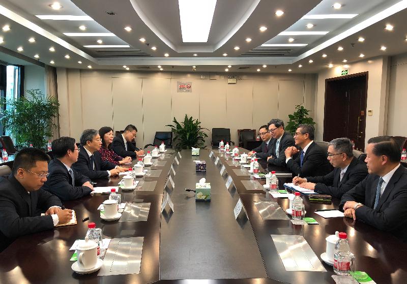 The Financial Secretary, Mr Paul Chan, today (November 20) visited Beijing. Photo shows Mr Chan (third right) meeting with the Governor of the People's Bank of China, Mr Yi Gang (third left). Also present are the Secretary for Financial Services and the Treasury, Mr James Lau (second right); the Chief Executive of the Hong Kong Monetary Authority, Mr Norman Chan (fourth right); the Chief Executive Officer of the Insurance Authority, Mr Clement Cheung (fifth right); and the Chairman of the Securities and Futures Commission, Mr Tim Lui (first right).