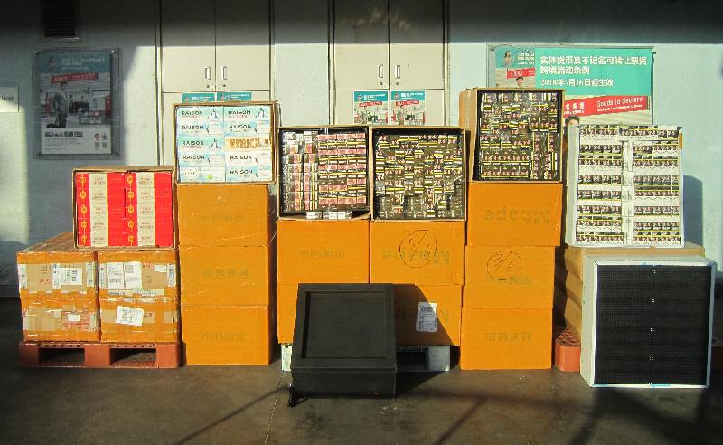 The Customs and Excise Department mounted a two-week operation codenamed "Trans Mountain II" during the Singles' Day sales period in mid-November to step up enforcement action against the smuggling of prohibited and controlled items through postal and cargo channels. Photo shows some of the suspected illicit cigarettes seized.