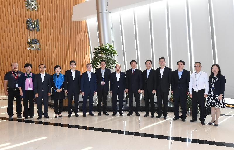 The Chief Secretary for Administration, Mr Matthew Cheung Kin-chung, today (November 29) led a delegation of Hong Kong Special Administrative Region Government officials to visit a Hong Kong enterprise that invested in the setting up of factories in Xiamen. Photo shows Mr Cheung (seventh right); the Secretary for Constitutional and Mainland Affairs, Mr Patrick Nip (fifth right); the Under Secretary for Innovation and Technology, Dr David Chung (sixth left); the Under Secretary for Education, Dr Choi Yuk-lin (fourth left); the Under Secretary for Commerce and Economic Development, Dr Bernard Chan (fourth right); the Under Secretary for Financial Services and the Treasury, Mr Joseph Chan (fifth left); and the Under Secretary for Home Affairs, Mr Jack Chan (seventh left); the Director of the Hong Kong Economic and Trade Office in Guangdong of the Government of the Hong Kong Special Administrative Region, Mr Albert Tang (third left), with the Chairman of the enterprise.