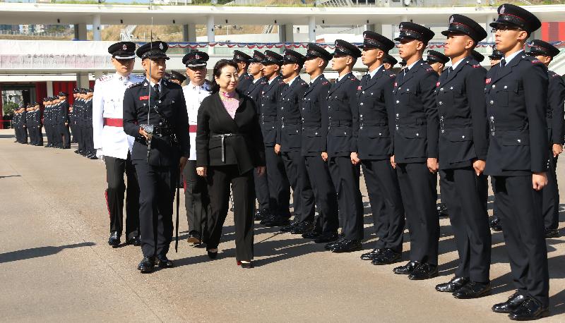 The Secretary for Justice, Ms Teresa Cheng, SC, reviews the 184th Fire Services passing-out parade at the Fire and Ambulance Services Academy today (November 30).