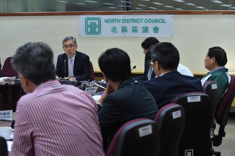 The Secretary for Financial Services and the Treasury, Mr James Lau (second left), visits the North District Council today (November 30) to discuss various issues of concern with its Chairman, Mr So Sai-chi (first right), and other members.