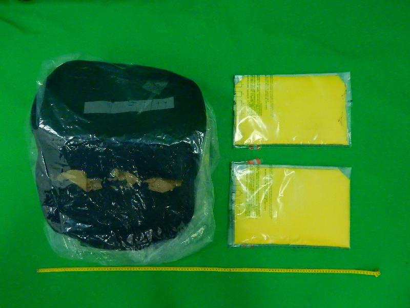 Hong Kong Customs seized about 2.1 kilograms of suspected cocaine in two packets concealed inside the false compartment of a suitcase at Hong Kong International Airport on November 30.