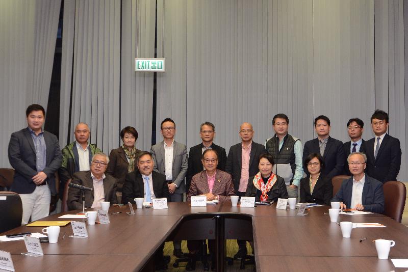 The Secretary for Justice, Ms Teresa Cheng, SC (front row, third right), meets with members of the Sai Kung District Council today (December 7) to exchange views on issues of concern.