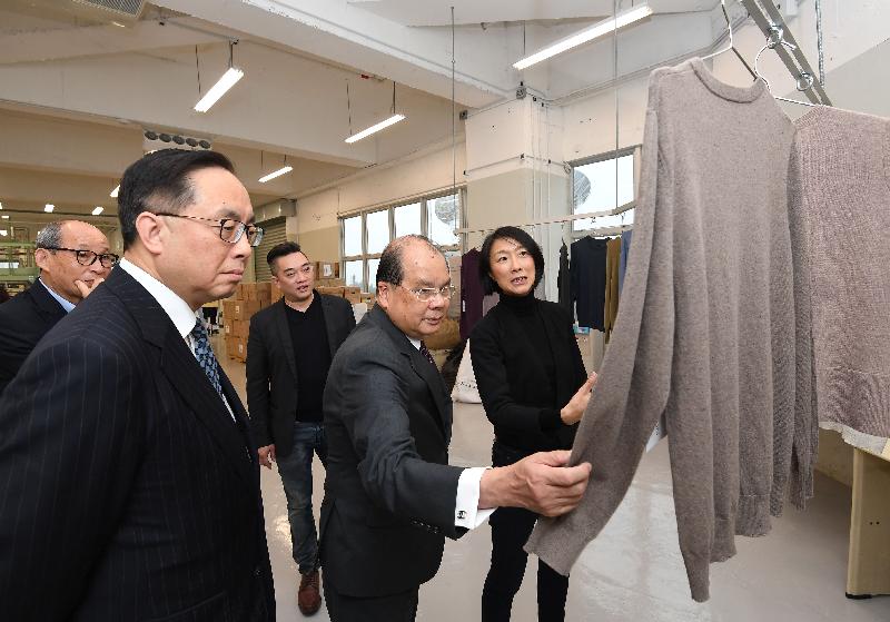 The Chief Secretary for Administration, Mr Matthew Cheung Kin-chung (second right), and the Secretary for Innovation and Technology, Mr Nicholas W Yang (second left), today (December 7) accompanied by the Chairman of the Tai Po District Council, Mr Cheung Hok-ming (first left), visit a recycling mill in the Precision Manufacturing Centre of the Tai Po Industrial Estate.