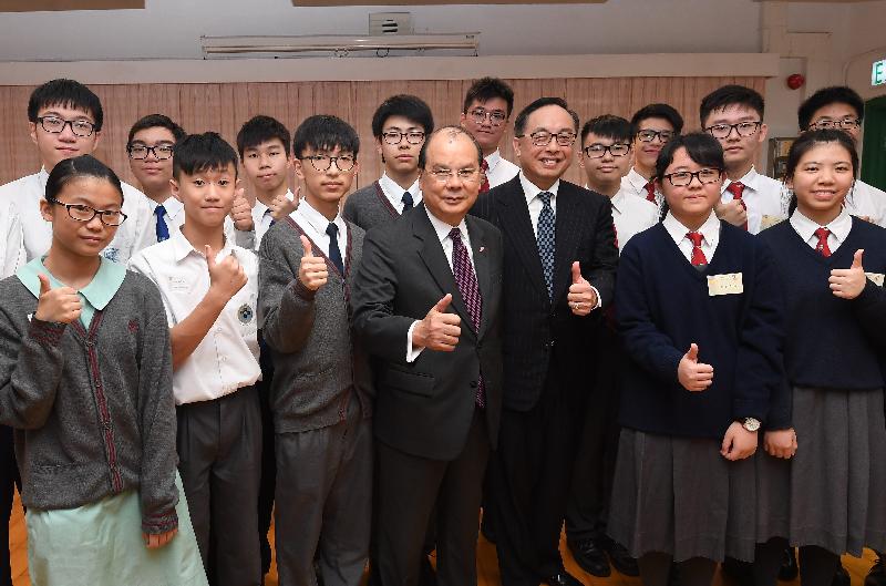 The Chief Secretary for Administration, Mr Matthew Cheung Kin-chung, and the Secretary for Innovation and Technology, Mr Nicholas W Yang, today (December 7) visited Tai Po District and met with students participated in a programme for promotion of science, technology, engineering and mathematics (STEM) education in Tai Po secondary schools. Photo shows Mr Cheung (front row, centre) and Mr Yang (front row, third right) with students.
