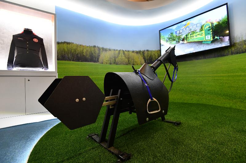 The opening ceremony of the HKSARG's Celebration of the 40th Anniversary of the Reform and Opening Up of the Country: 'Joint Development·Shared Prosperity' Exhibition was held today (December 11) at the Hong Kong Museum of History. Photo shows the interactive equestrian jumping game in the sports zone.