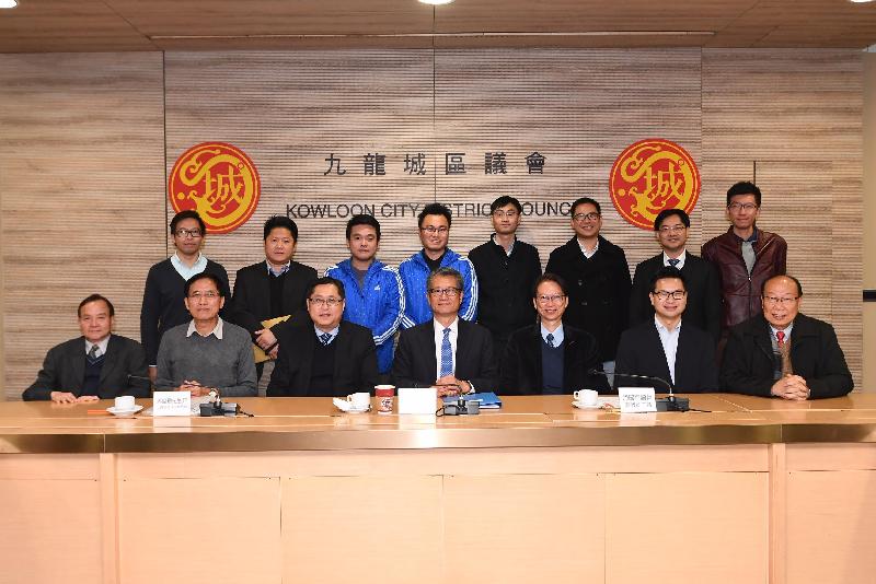 The Financial Secretary, Mr Paul Chan, visited Kowloon City District today (December 12). Mr Chan (front row, centre) is pictured with the Chairman of the Kowloon City District Council (KCDC), Mr Pun Kwok-wah (front row, third right); the Vice Chairman of the KCDC, Mr Cho Wui-hung (front row, second right); the District Officer (Kowloon City), Mr Franco Kwok (front row, third left); and members of the KCDC.