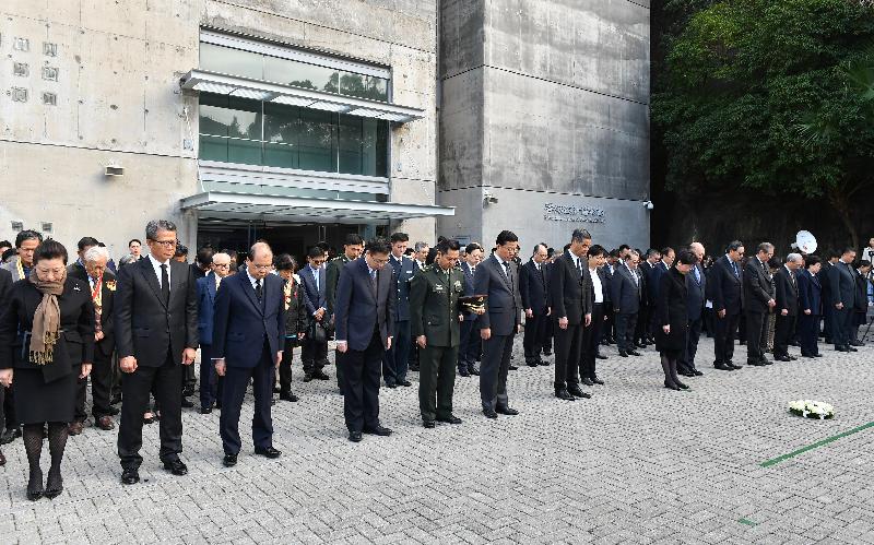 The Chief Executive, Mrs Carrie Lam, attended a ceremony to commemorate Nanjing Massacre National Memorial Day at the Hong Kong Museum of Coastal Defence this morning (December 13). Photo shows (front row, from left) the Secretary for Justice, Ms Teresa Cheng, SC; the Financial Secretary, Mr Paul Chan; the Chief Secretary for Administration, Mr Matthew Cheung Kin-chung; Deputy Director of the Liaison Office of the Central People's Government in the Hong Kong Special Administrative Region (HKSAR) Mr He Jing; the Political Commissar of the Chinese People's Liberation Army Hong Kong Garrison, Mr Cai Yongzhong; the Commissioner of the Ministry of Foreign Affairs of the People's Republic of China in the HKSAR, Mr Xie Feng; Vice-Chairman of the National Committee of the Chinese People's Political Consultative Conference Mr C Y Leung; Mrs Lam; the Chief Justice of the Court of Final Appeal, Mr Geoffrey Ma Tao-li; the President of the Legislative Council, Mr Andrew Leung; Non-official Member of the Executive Council Professor Arthur Li; and other attendees observing two minutes' silence at the ceremony.