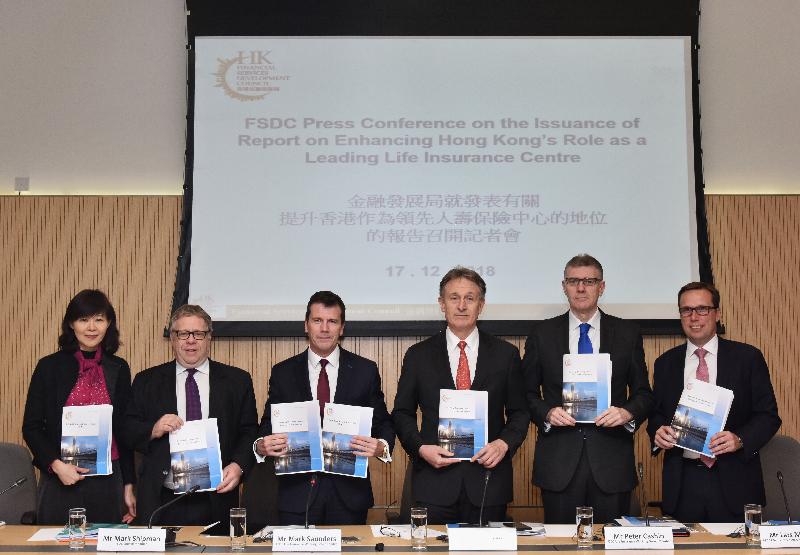 The leader of the Financial Services Development Council (FSDC) Life Insurance Working Group, Mr Mark Saunders (third left), together with FSDC Council Members Mr Mark Shipman  (second left) and Ms Winnie Wong (first left) and working group members Mr Donald Kanak (third right), Mr Peter Cashin (second right) and Mr Lars Nielsen (first right) released a report entitled "Enhancing Hong Kong's Role as a Leading Life Insurance Centre" at a press conference today (December 17).