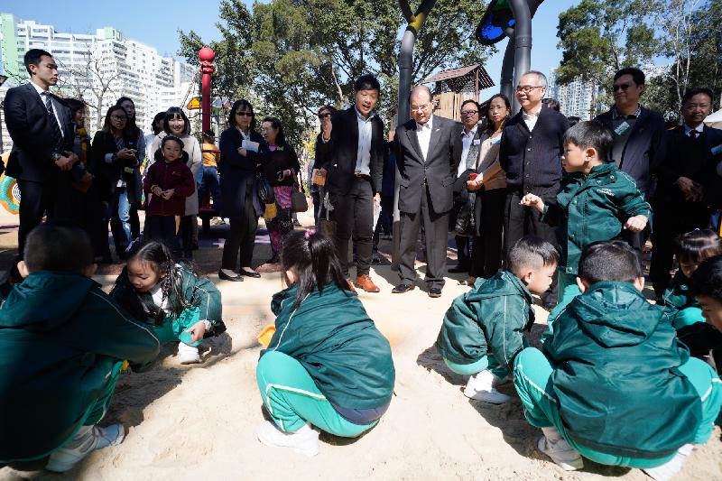 The Chief Secretary for Administration, Mr Matthew Cheung Kin-chung, attended the Tuen Mun Park Inclusive Playground Opening Ceremony today (December 17). Photo shows Mr Cheung (front row, fourth right); the Secretary for Home Affairs, Mr Lau Kong-wah (front row, third right); and other guests receiving a briefing by Landscape Architect of the Architectural Services Department Mr Chan Chun-ho (front row, fifth right) on the playground facilities. 