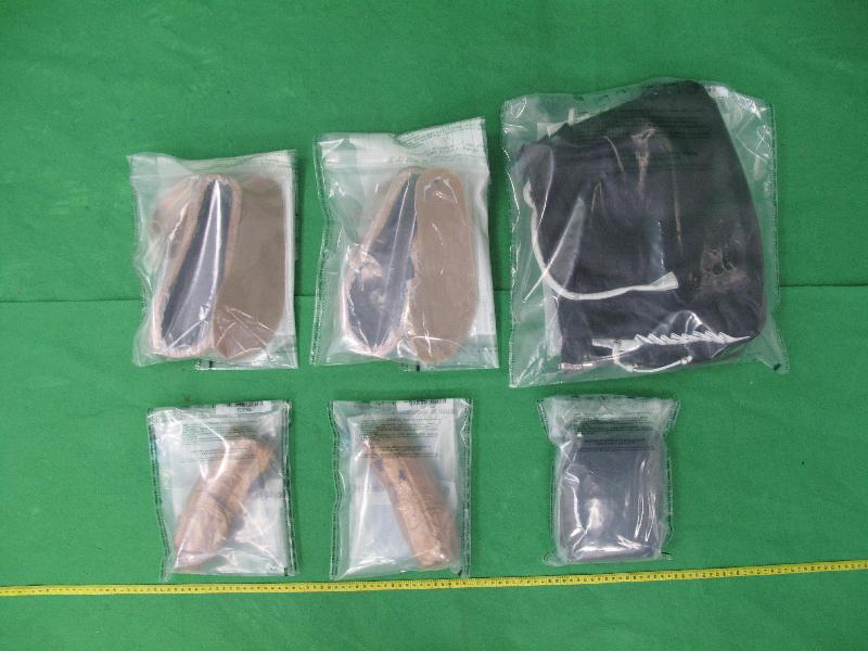 The Customs and Excise Department conducted an operation during the Christmas and New Year holidays at the airport, seaport, land boundary and railway control points in a bid to combat smuggling and other illegal activities through passenger and cargo channels. Customs officers seized about 2.1 kilograms of suspected cocaine with an estimated market value of about $2.4 million at Hong Kong International Airport on December 23.