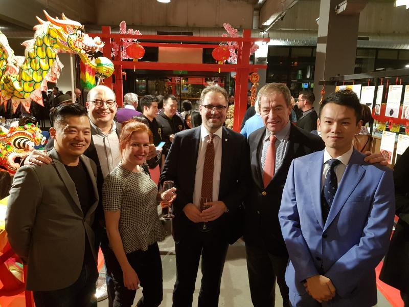 Assistant Representative of the Hong Kong Economic and Trade Office, Brussels, Mr Jeffrey Chim (first right); the Chairman of the Belgium-Hong Kong Society, Mr Piet Steel (second right); Alderman for Finance, Mobility, City Parks, Retailers and Decentralisation of the City of Antwerp, Mr Koen Kennis (third right); the Head of Asian Events Tofoe and member of the Choi Lee Fat Belgium Kungfu Lion and Dragon Dance Association, Mr Joe Choi (first left); and other officiating guests are pictured at the opening reception of the "Legend of Lion Dance" exhibition in Antwerp, Belgium, on January 18 (Antwerp time).