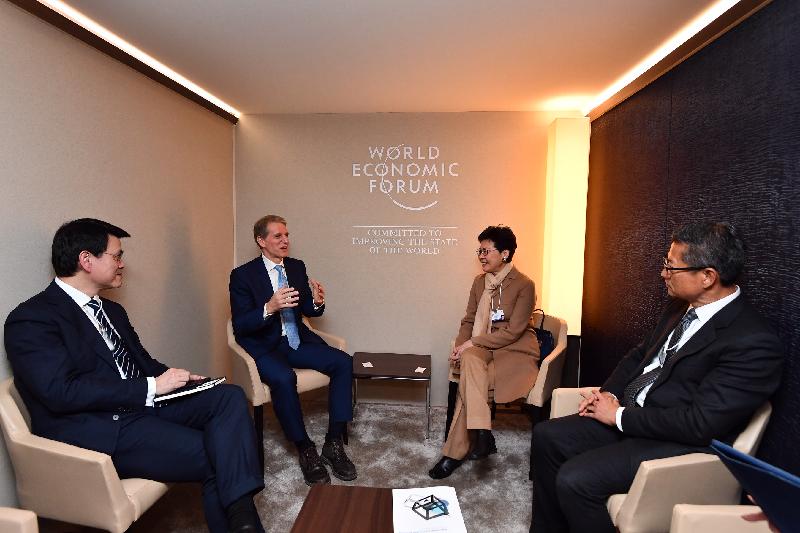 The Chief Executive, Mrs Carrie Lam, attended the World Economic Forum Annual Meeting in Davos, Switzerland yesterday (January 22, Davos time). Photo shows Mrs Lam (second right), accompanied by the Financial Secretary, Mr Paul Chan (first right), and the Secretary for Commerce and Economic Development, Mr Edward Yau (first left), meeting with the Executive Vice President and General Counsel of Marsh & McLennan Companies, Mr Peter Beshar (second left).