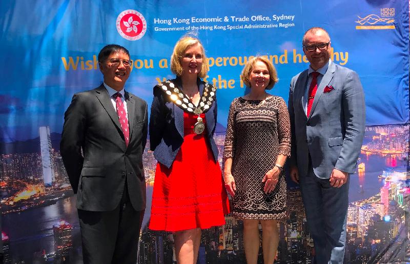 The Hong Kong Economic and Trade Office, Sydney (HKETO) is participating in the three-week-long Chatswood Year of the Pig Festival 2019 in the Chatswood district of Sydney, Australia, to share the joy of the Lunar New Year with the public in Sydney. Photo shows the Director of the Hong Kong Economic and Trade Office, Sydney, Mr Raymond Fan (first left) and the Mayor of the Willoughby City Council, Ms Gail Giles-Gidney (second left), yesterday (January 29, Sydney time) in front of a giant photo wall featuring a night view of Hong Kong's Victoria Harbour.