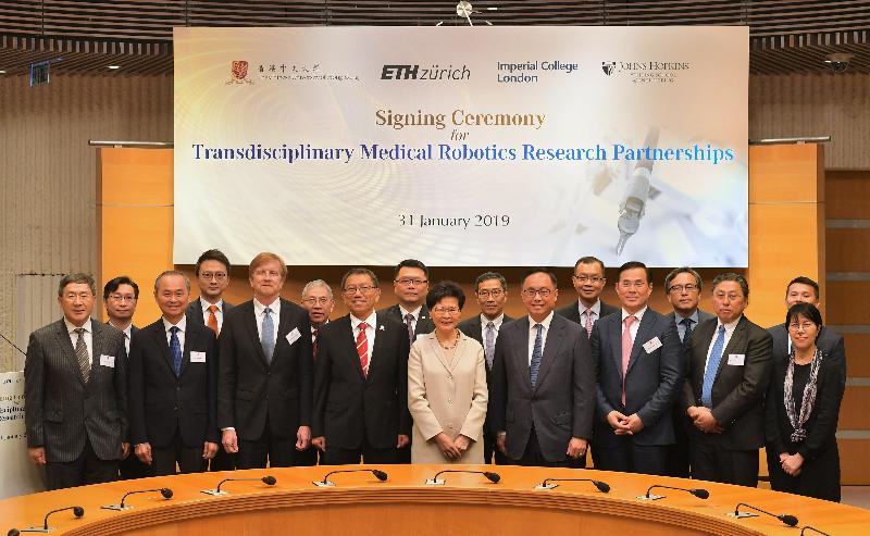 The Chief Executive, Mrs Carrie Lam, attended the Signing Ceremony for Transdisciplinary Medical Robotics Research Partnerships between the Chinese University of Hong Kong (CUHK) and overseas institutes today (January 31). Photo shows Mrs Lam (front row, centre); the Secretary for Innovation and Technology, Mr Nicholas W Yang (front row, fourth right); the Vice-Chancellor and President of CUHK, Professor Rocky Tuan (front row, fourth left); representatives of CUHK, ETH Zurich, the Imperial College London and Johns Hopkins University; and other guests after the Signing Ceremony. 