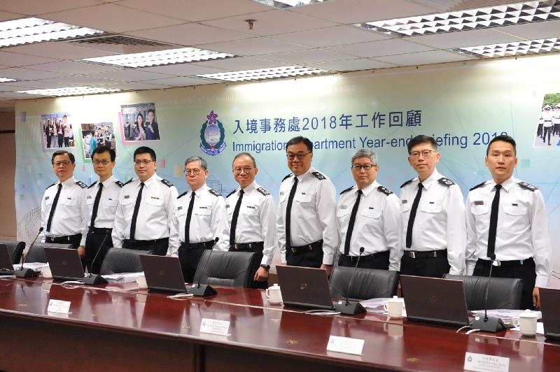 The Director of Immigration, Mr Tsang Kwok-wai (fifth right), chairs the press conference of the Immigration Department's year-end review of 2018 today (February 1).