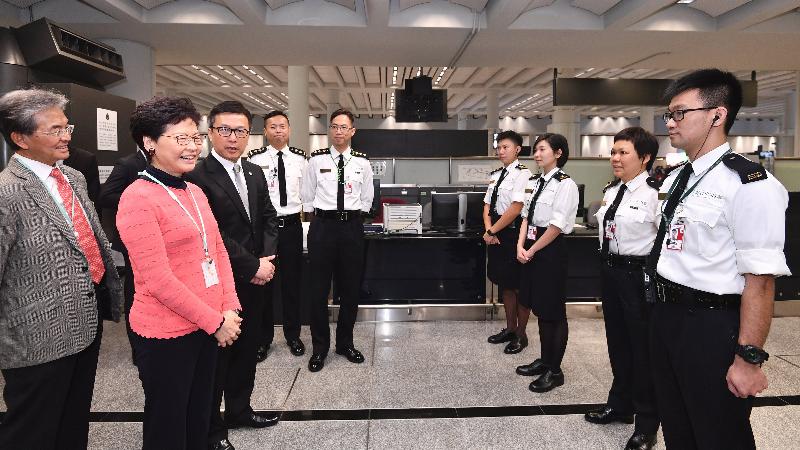 The Chief Executive, Mrs Carrie Lam, attended the Chinese New Year festive activities at Hong Kong International Airport today (February 5). Photo shows Mrs Lam (second left), accompanied by the Commissioner of Customs and Excise, Mr Hermes Tang (third left), visiting front-line officers of the Customs and Excise Department on duty at the airport to thank them for their dedication during the festive season. 