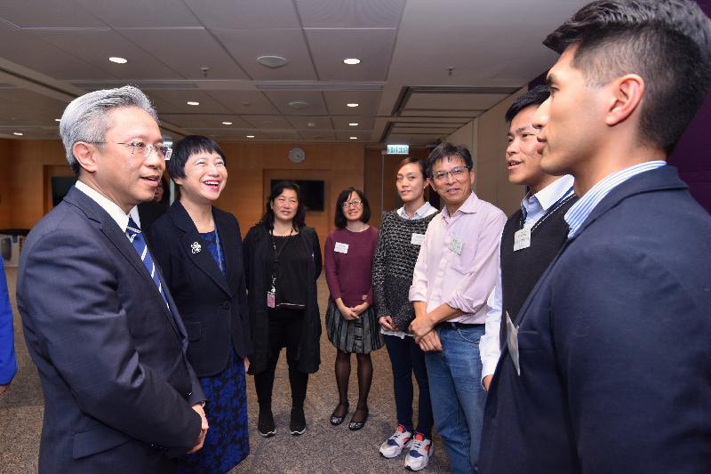 The Secretary for the Civil Service, Mr Joshua Law, visited the Judiciary today (February 13). Photo shows Mr Law (first left) meeting with staff representatives of various civil service grades in the Judiciary Administration at a tea gathering to exchange views on matters that concerned them. Looking on is the Judiciary Administrator, Miss Emma Lau (second left).