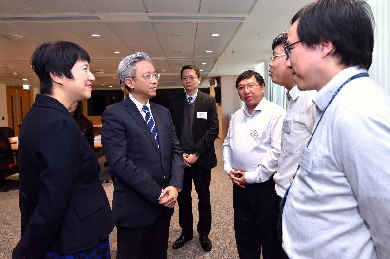 The Secretary for the Civil Service, Mr Joshua Law, visited the Judiciary today (February 13). Photo shows Mr Law (second left) meeting with staff representatives of various civil service grades in the Judiciary Administration at a tea gathering to exchange views on matters that concerned them. Looking on is the Judiciary Administrator, Miss Emma Lau (first left).