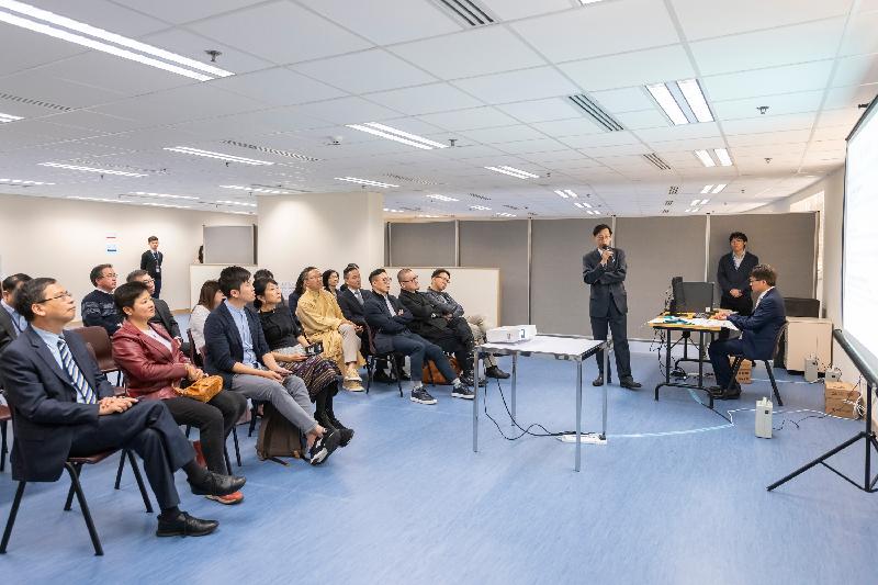 The Legislative Council Panel on Constitutional Affairs visits the Registration and Electoral Office (REO) today (February 13) to receive a briefing from the Chief Electoral Officer of REO, Mr Wong See-man (standing in the middle), on the functions of electronic vote-counting machines.