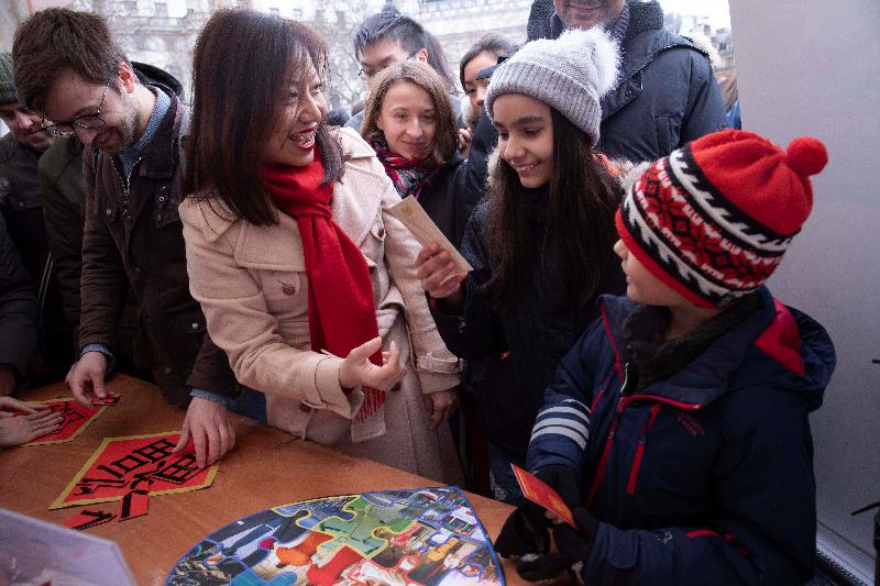 The Hong Kong Economic and Trade Office, London (London ETO) sponsored the London Chinatown Chinese New Year celebration in Trafalgar Square and Chinatown on February 10 (London time). Photo shows the Director-General of the London ETO, Ms Priscilla To, interacting with visitors and playing Hong Kong-themed games at the London ETO's marquee in Trafalgar Square.