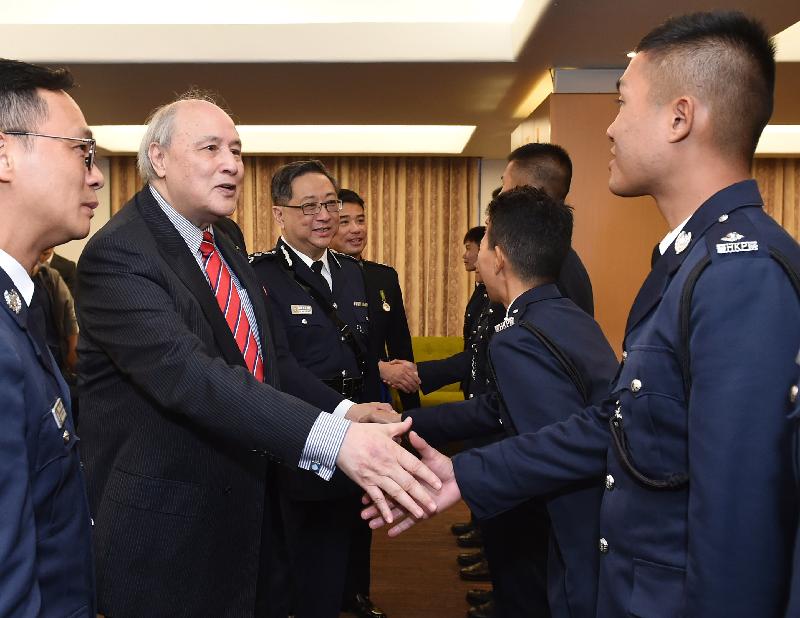 The Chairman of the Independent Police Complaints Council, Dr Anthony Francis Neoh (second left), and the Commissioner of Police, Mr Lo Wai-chung (third left) congratulate the probationary inspectors after the passing-out parade held at the Hong Kong Police College today (February 16).
