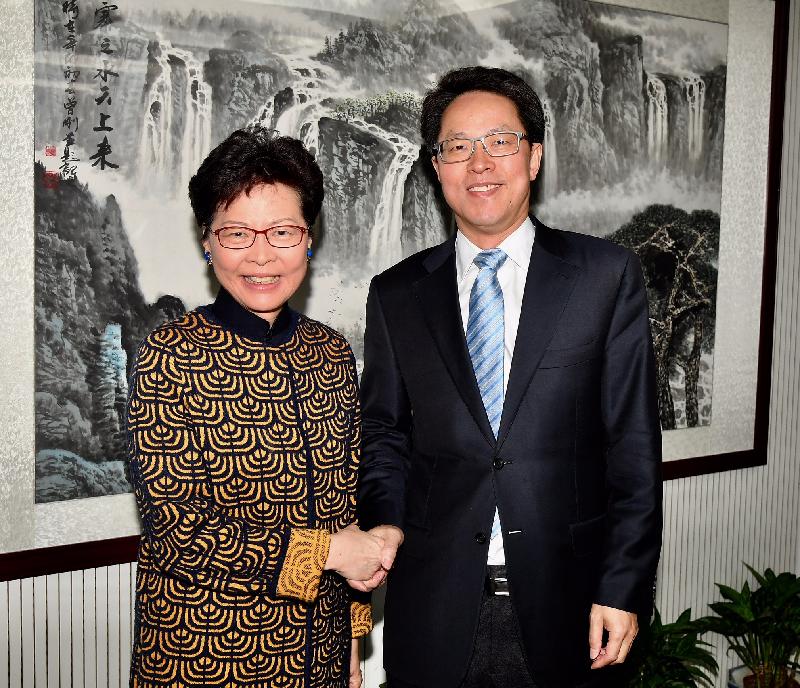 The Chief Executive, Mrs Carrie Lam (left), met with the Director of the Hong Kong and Macao Affairs Office of the State Council, Mr Zhang Xiaoming (right), in Beijing this morning (March 2). Photo shows them shaking hands before the meeting.