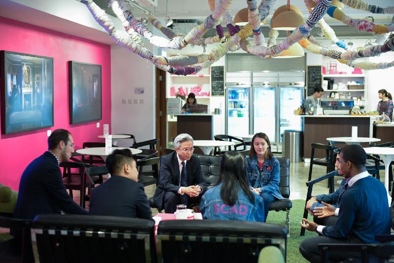 The Secretary for the Civil Service, Mr Joshua Law, visited Sham Shui Po District today (March 6). Photo shows Mr Law (third left) chatting with students of the Savannah College of Art and Design Hong Kong to understand their learning experience and visions for the future.