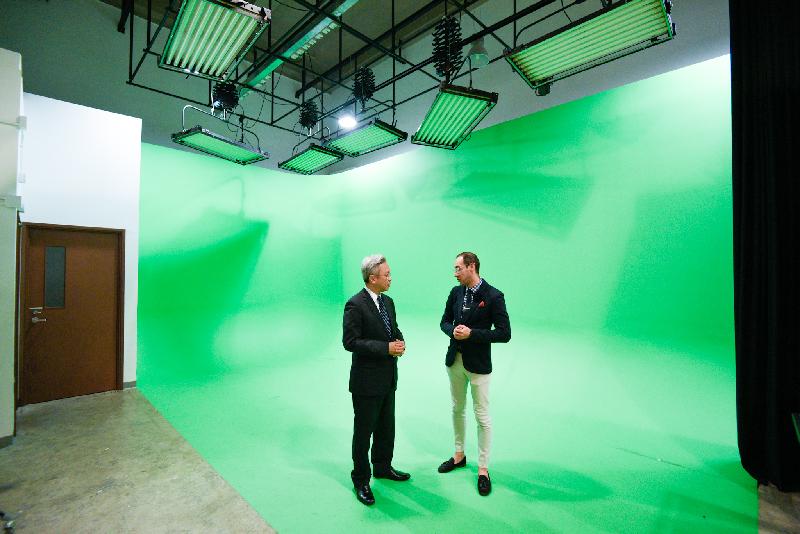 The Secretary for the Civil Service, Mr Joshua Law, visited Sham Shui Po District today (March 6). Photo shows Mr Law (left) touring a green screen studio in the Savannah College of Art and Design (SCAD) Hong Kong. Joining him is the Executive Director of Design and Operations of SCAD Hong Kong, Mr Bernardo Coronado-Guerra (right).