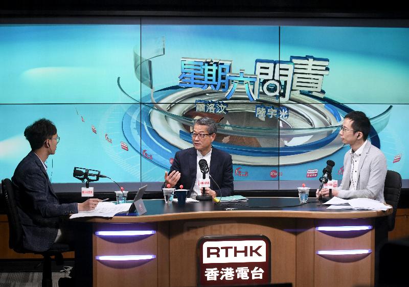 The Financial Secretary, Mr Paul Chan (centre), attends Radio Television Hong Kong's programme "Accountability" this morning (March 9) to answer questions on the 2019-20 Budget.
