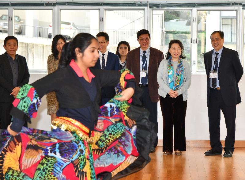 The Secretary for Justice, Ms Teresa Cheng, SC, visits Caritas Wu Cheng-chung Secondary School in Pokfulam today (March 12). Photo shows Ms Cheng (second right) watching a dancing performance by students.