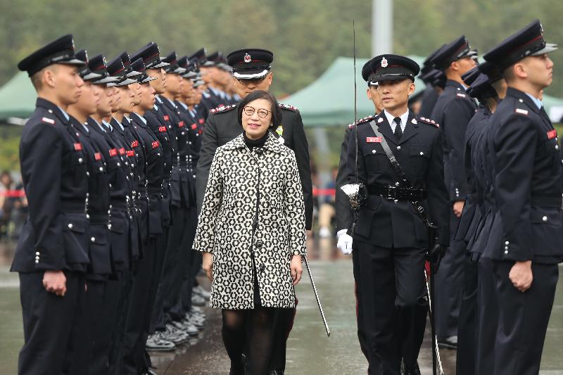The Secretary for Food and Health, Professor Sophia Chan, reviews the 185th Fire Services passing-out parade at the Fire and Ambulance Services Academy today (March 14). 