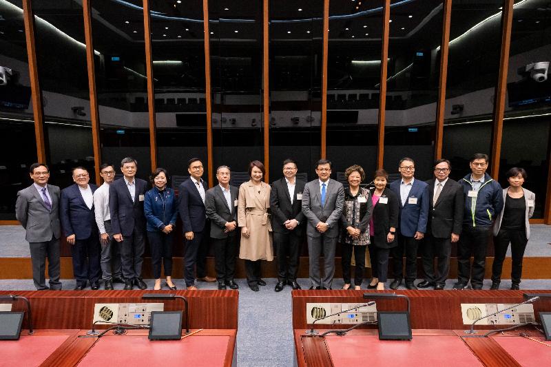 Members of the Legislative Council (LegCo) and the Kwai Tsing District Council are pictured after the meeting held in the LegCo Complex today (March 22).