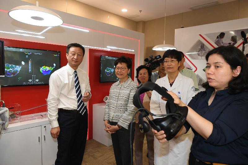 The Chief Executive, Mrs Carrie Lam, visited the Boao Lecheng International Medical Tourism Pilot Zone to learn about its operation during the Boao Forum for Asia Annual Conference 2019 in Hainan today (March 29). Photo shows Mrs Lam (second left) being briefed by staff on the operation of the hospital in the Pilot Zone.