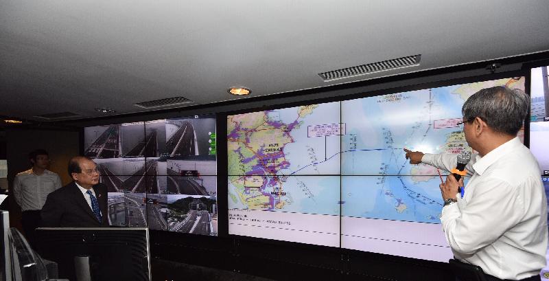 The Chief Secretary for Administration, Mr Matthew Cheung Kin-chung, visited the Transport Department this afternoon (March 29). Photo shows Mr Cheung (second left) observing a demonstration of the operation of the Traffic Control and Surveillance Systems for the Hong Kong-Zhuhai-Macao Bridge.