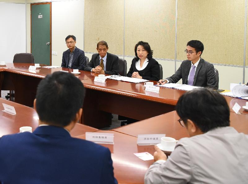 The Secretary for Justice, Ms Teresa Cheng, SC (second right), meets with the Chairman of the Islands District Council, Mr Chow Yuk-tong (third right), and other District Council members today (April 1) to exchange views on issues of concern.