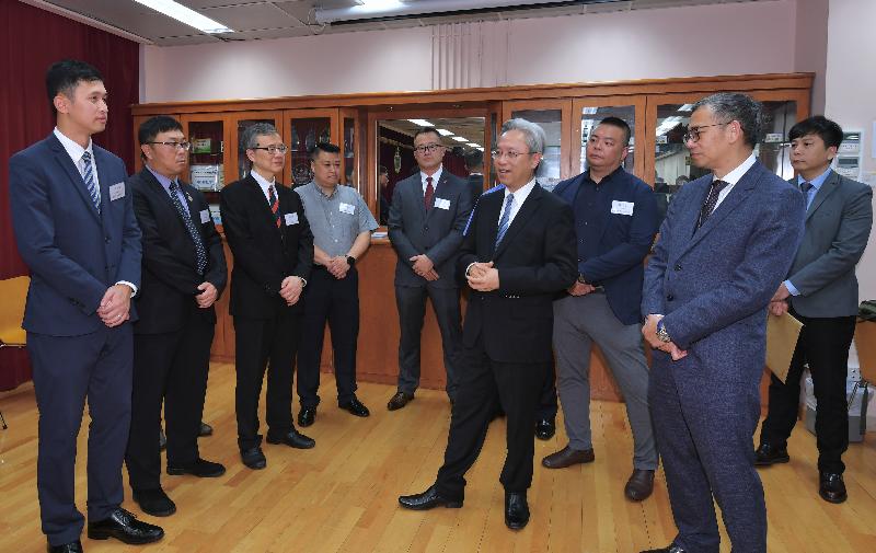 The Secretary for the Civil Service, Mr Joshua Law, visited the Correctional Services Department today (April 3). Photo shows Mr Law (front row, second right) meeting with staff representatives of various grades at a tea gathering to exchange views on matters of concern. Looking on is the Commissioner of Correctional Services, Mr Woo Ying-ming (front row, first right).