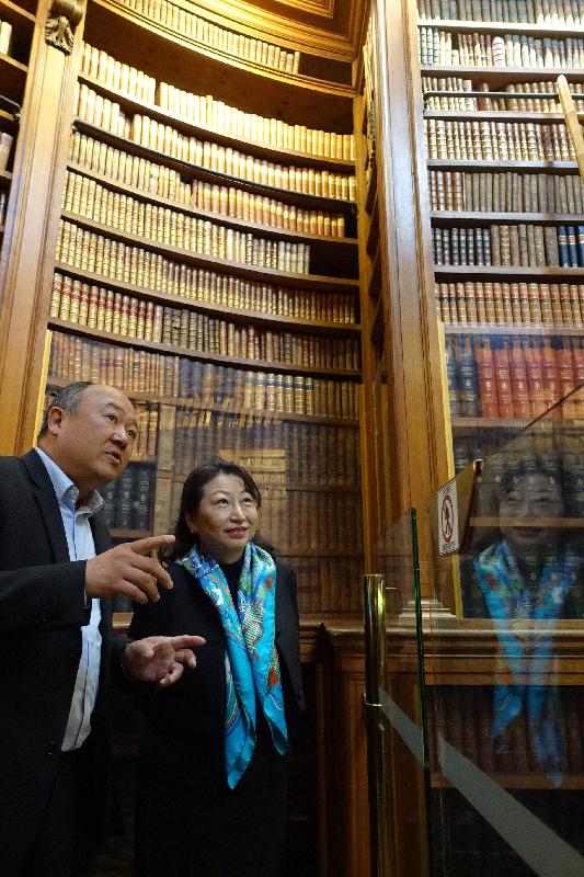 The Secretary for Justice, Ms Teresa Cheng, SC (right), accompanied by the President of the France-China Friendship Group of the National Assembly of France, Mr Buon Huong Tan (left), tours the library of the National Assembly in Paris today (April 11, Paris time). 
