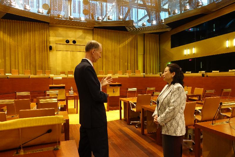 The Secretary for Justice, Ms Teresa Cheng, SC (right), accompanied by Judge Christopher Vajda (left), tours the Main Courtroom of the European Union Court of Justice in Luxembourg today (April 12, Luxembourg time).