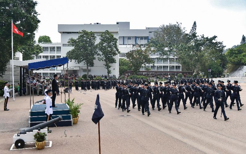 The Secretary for Security, Mr John Lee, inspects a passing-out parade of 34 probationary inspectors and 194 recruit police constables at the Hong Kong Police College today (April 13).