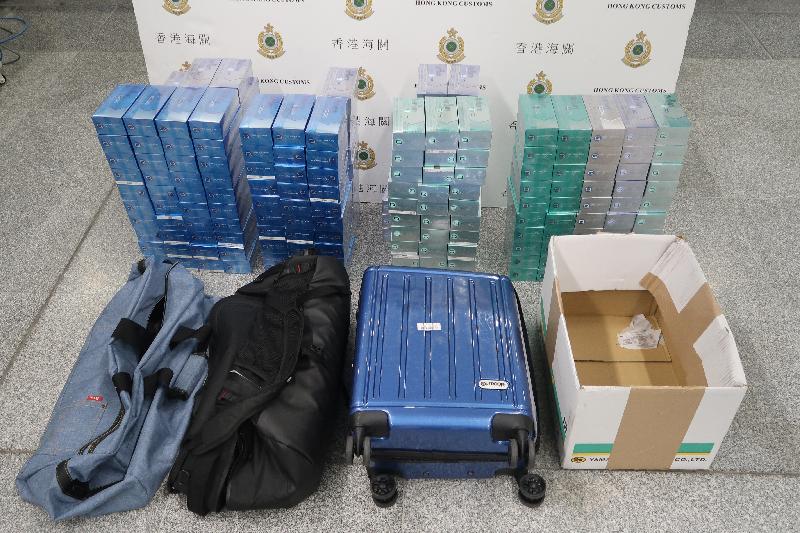 Hong Kong Customs has mounted a special operation codenamed "Tidal Wave", focusing on illicit heat-not-burn (HNB) products smuggled into Hong Kong, at the airport, seaport, land boundary and railway control points since January 1 this year. Until yesterday (April 14), Customs detected a total of 225 cases, arrested 195 persons and seized about 1.26 million suspected illicit HNB products with an estimated market value of about $3.6 million and a duty potential of about $2.4 million. Photo shows some of the suspected illicit HNB products seized.