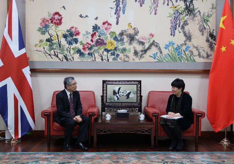 The Secretary for Financial Services and the Treasury, Mr James Lau (left), paid a courtesy call on the Acting Chinese Ambassador to the UK, Ms Chen Wen (right), in London on May 7 (London time).