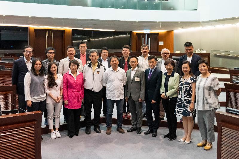 Members of the Legislative Council (LegCo) and the Sham Shui Po District Council are pictured after a meeting held in the LegCo Complex today (May 14).