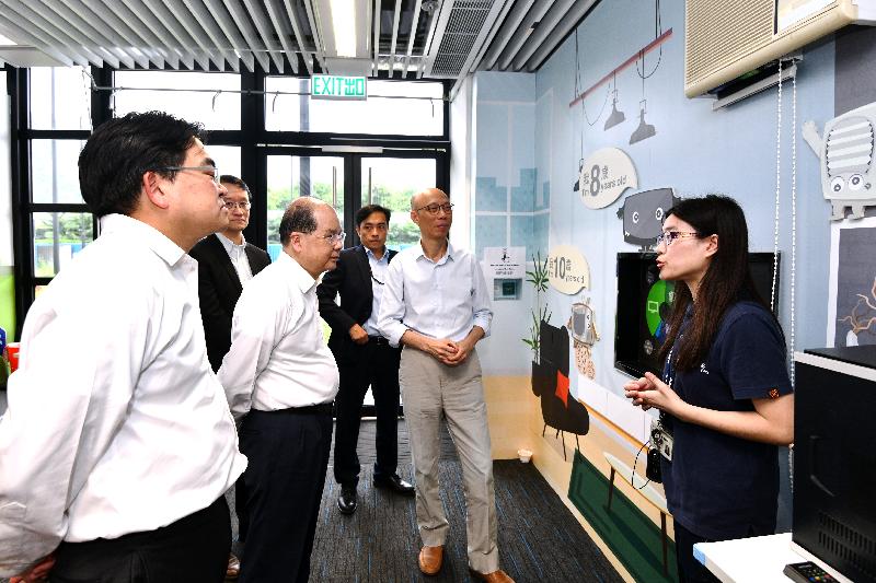 The Chief Secretary for Administration, Mr Matthew Cheung Kin-chung (fourth right), accompanied by the Secretary for the Environment, Mr Wong Kam-sing (second right), visits WEEE•PARK within the EcoPark in Tuen Mun today (May 15) to learn about how WEEE•PARK provides essential infrastructure for the full implementation of the Producer Responsibility Scheme on Waste Electrical and Electronic Equipment.