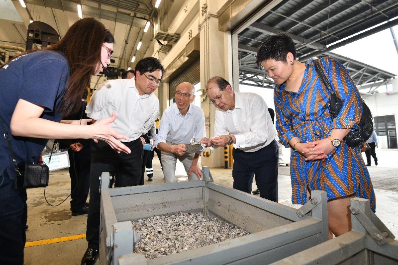 The Chief Secretary for Administration, Mr Matthew Cheung Kin-chung, accompanied by the Secretary for the Environment, Mr Wong Kam-sing, visited the WEEE·PARK within the EcoPark in Tuen Mun today (May 15). Photo shows Mr Cheung (second right) and Mr Wong (third right) being briefed on how advanced technologies and equipment in WEEE·PARK can help transform waste regulated electrical equipment into valuable secondary raw materials through detoxification, dismantling and recycling processes. 